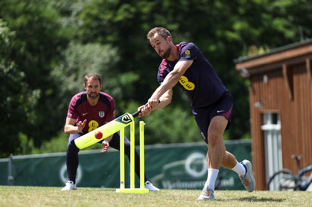 Harry Kane and Gareth Southgate playing cricket at an England camp